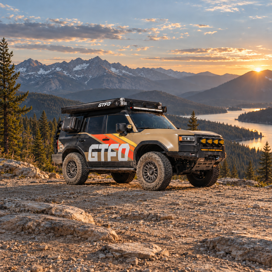 GTFO-branded overland vehicle and rooftop awning on a mountain overlook