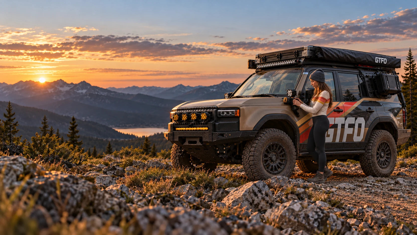 An overland vehicle beside a mountain trail