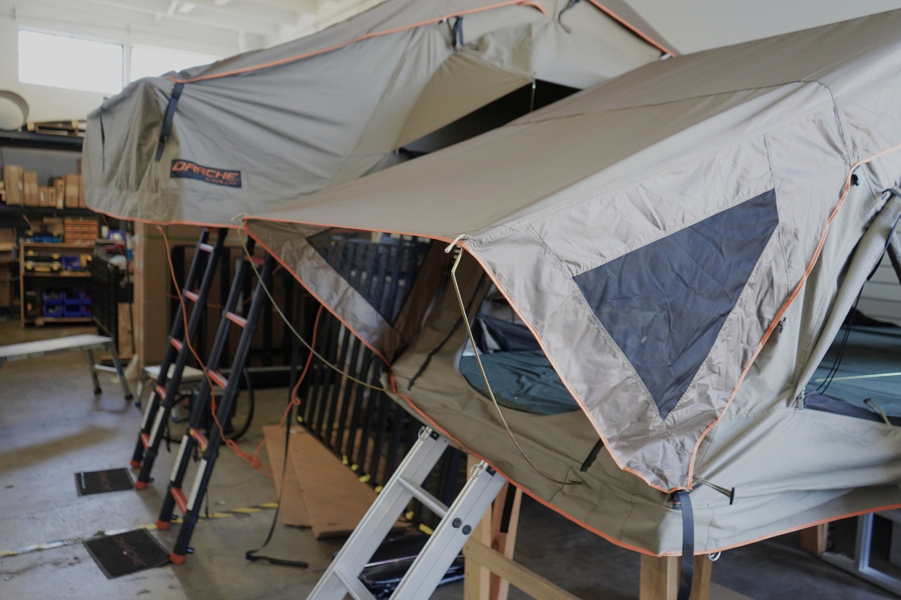photo of roof top tents set up inside the GTFOverland shop in Long Beach California.