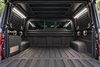 GTFO camper light kit in white mode illuminating an empty truck bed, viewed through the open canopy
