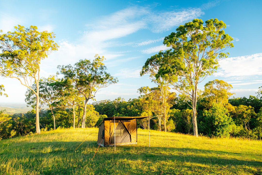 Oztent RV-3 tent on a grassy clearing