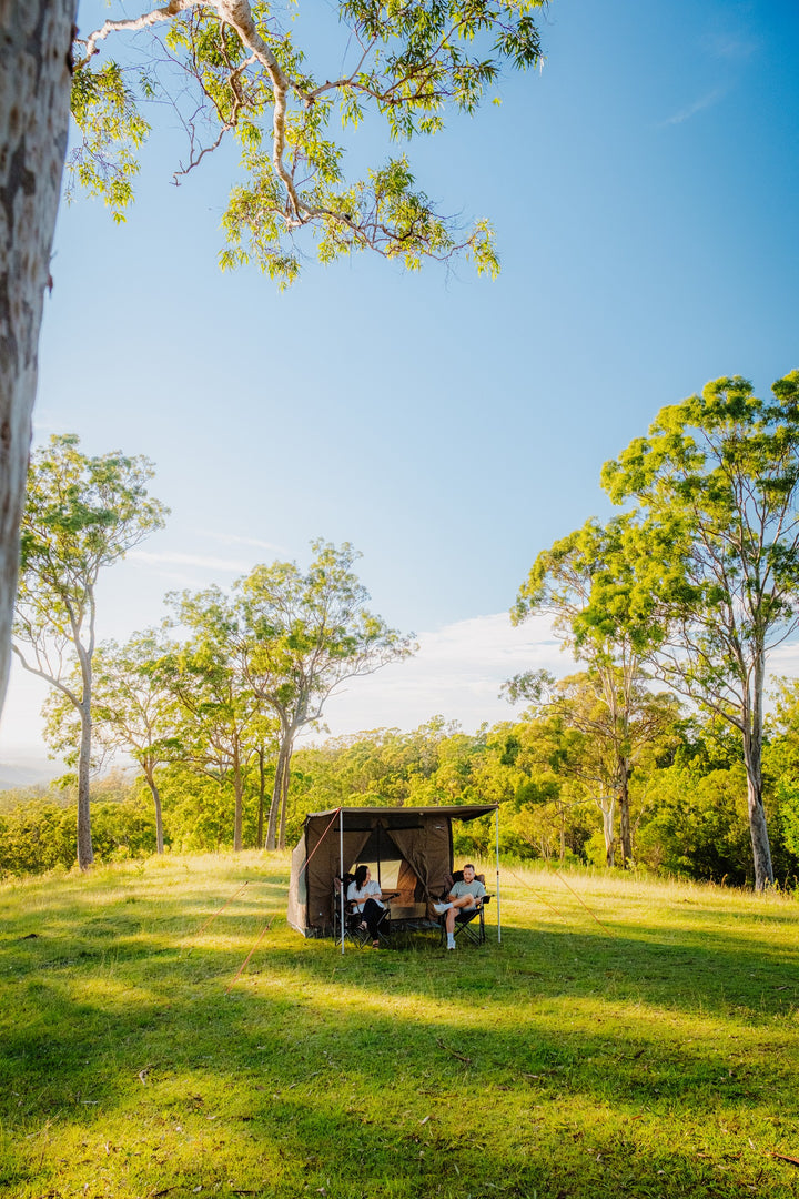 Oztent RV-3 tent and campers in an open woodland setting