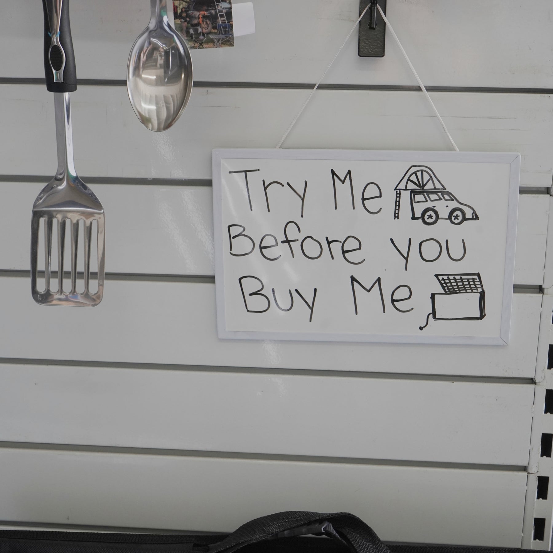 photo of a hand-drawn note saying try me before you buy me.